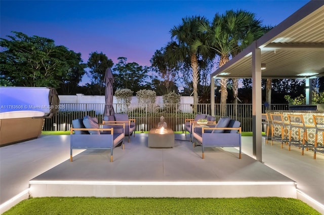 8608 Torrey Isles Ter, Boca Raton, FL 33496 - patio terrace at dusk with a patio and an outdoor living space with a fire pit