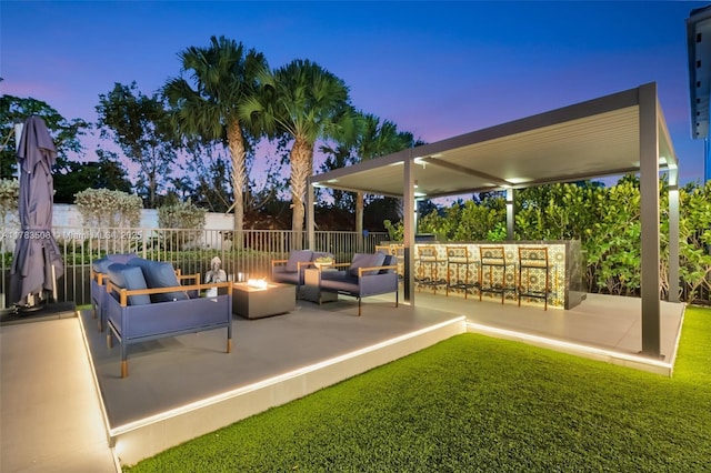 8608 Torrey Isles Ter, Boca Raton, FL 33496 - patio terrace at dusk featuring an outdoor living space with a fire pit and a patio area