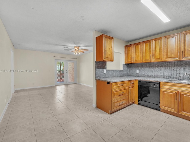 kitchen featuring a ceiling fan, a sink, light tile patterned floors, dishwasher, and backsplash