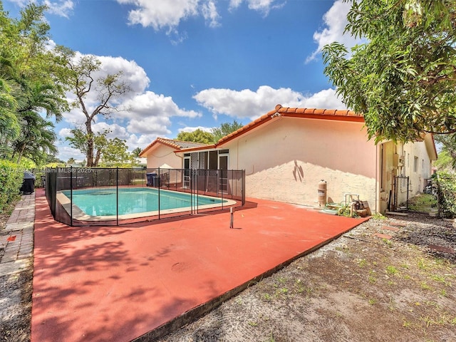 view of pool featuring a fenced in pool, a patio, and fence