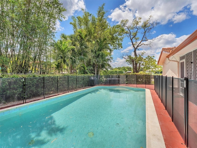 view of pool featuring fence and a fenced in pool