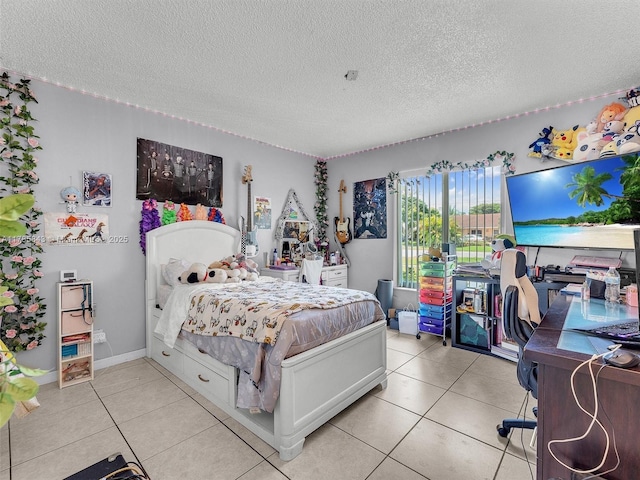 bedroom featuring a textured ceiling and light tile patterned floors