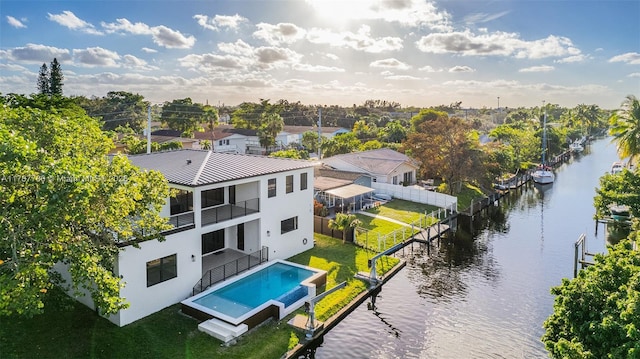 birds eye view of property with a residential view and a water view