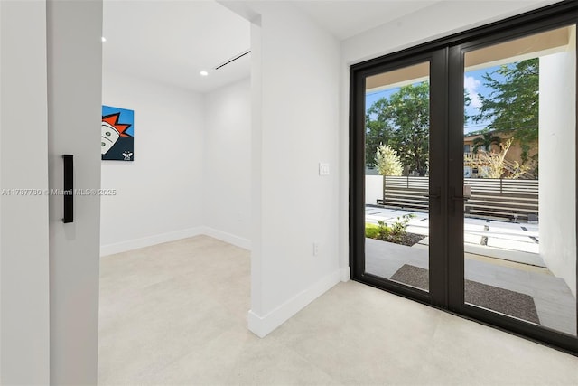 entryway featuring baseboards, french doors, and recessed lighting