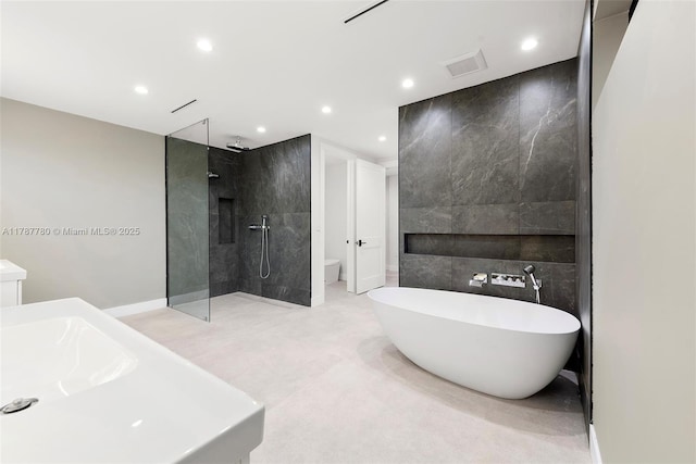full bathroom with a soaking tub, tile walls, visible vents, recessed lighting, and a walk in shower