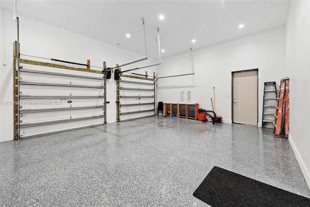 garage with baseboards and recessed lighting