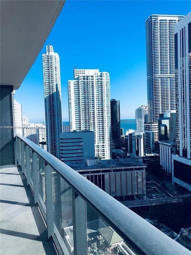 balcony with a city view and a water view