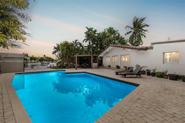 pool featuring a patio area