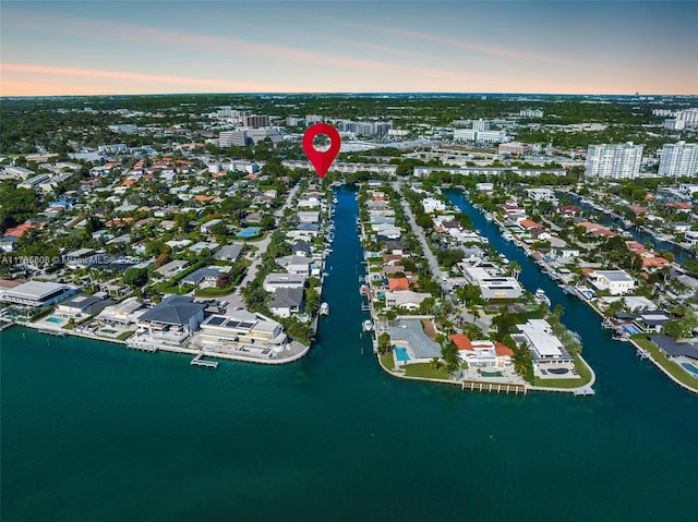 aerial view at dusk with a water view
