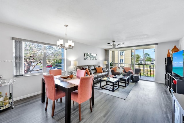 dining room featuring a wealth of natural light, wood finished floors, and baseboards