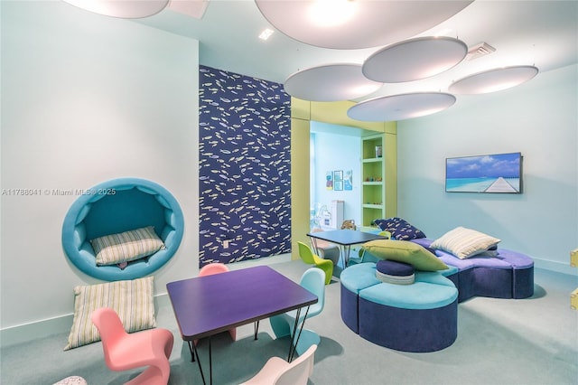 interior space featuring carpet floors and visible vents