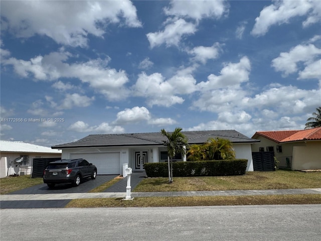 1531 SW 126th Pl, Miami, FL 33184 - ranch-style house featuring a front lawn, aphalt driveway, stucco siding, french doors, and an attached garage
