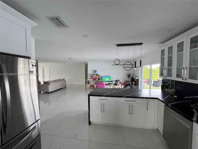 1531 SW 126th Pl, Miami, FL 33184 - kitchen with visible vents, freestanding refrigerator, a peninsula, marble finish floor, and open floor plan