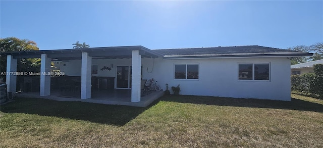1531 SW 126th Pl, Miami, FL 33184 - back of house featuring a patio, stucco siding, and a yard