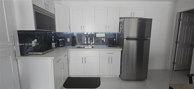 1531 SW 126th Pl, Miami, FL 33184 - kitchen with white cabinets, stainless steel appliances, decorative backsplash, and a sink