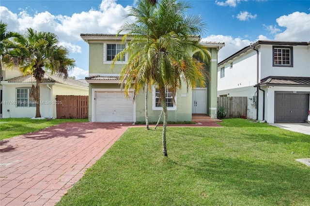 16122 SW 104th Ter, Miami, FL 33196 - view of front of home featuring stucco siding, fence, decorative driveway, and a garage