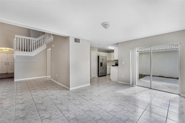 16122 SW 104th Ter, Miami, FL 33196 - unfurnished living room featuring baseboards, light tile patterned flooring, and visible vents
