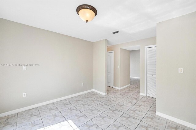 16122 SW 104th Ter, Miami, FL 33196 - unfurnished room featuring visible vents, baseboards, and light tile patterned floors