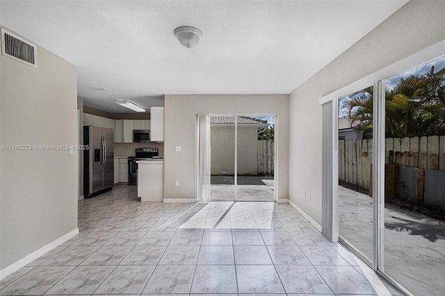 16122 SW 104th Ter, Miami, FL 33196 - interior space with baseboards, visible vents, and light tile patterned floors