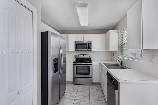 16122 SW 104th Ter, Miami, FL 33196 - kitchen featuring a sink, marble finish floor, stainless steel appliances, light countertops, and white cabinetry