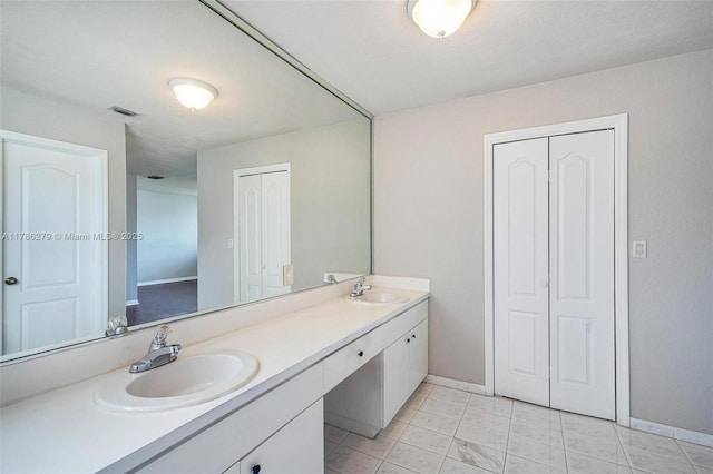16122 SW 104th Ter, Miami, FL 33196 - full bath with baseboards, visible vents, a sink, and double vanity