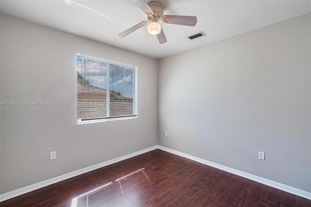 16122 SW 104th Ter, Miami, FL 33196 - empty room with wood finished floors, visible vents, baseboards, and ceiling fan
