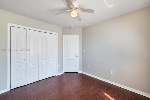 16122 SW 104th Ter, Miami, FL 33196 - unfurnished bedroom with a closet, a ceiling fan, baseboards, and dark wood-style floors