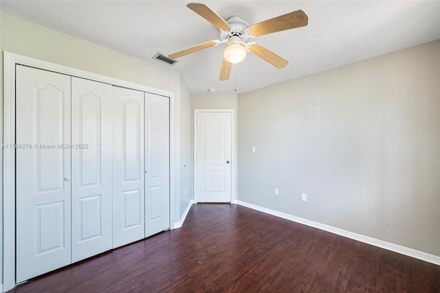 16122 SW 104th Ter, Miami, FL 33196 - unfurnished bedroom with a ceiling fan, a closet, baseboards, dark wood-style flooring, and visible vents