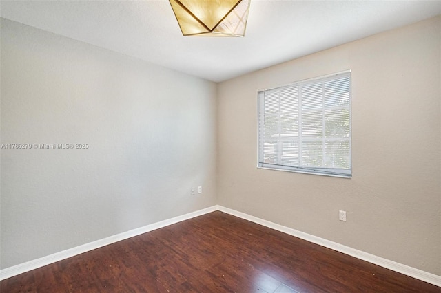16122 SW 104th Ter, Miami, FL 33196 - empty room with dark wood finished floors and baseboards