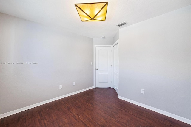 16122 SW 104th Ter, Miami, FL 33196 - empty room featuring baseboards, wood finished floors, and visible vents