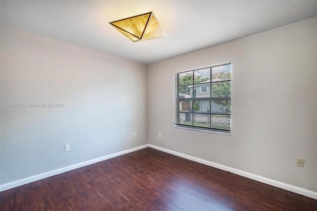 16122 SW 104th Ter, Miami, FL 33196 - spare room with baseboards and wood finished floors