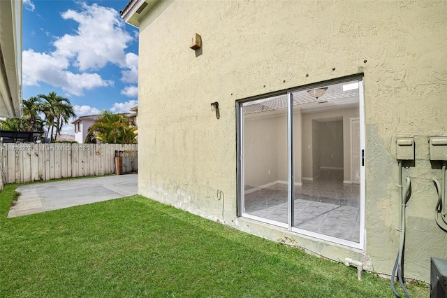 16122 SW 104th Ter, Miami, FL 33196 - exterior space with stucco siding, a yard, a patio area, and fence