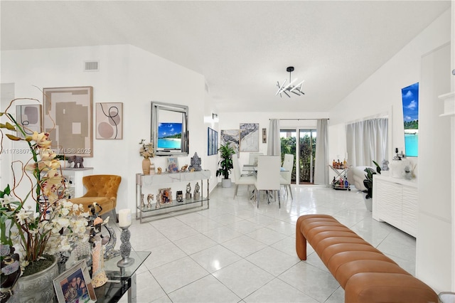living room featuring an inviting chandelier, lofted ceiling, visible vents, and light tile patterned floors
