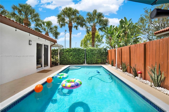 view of pool with a fenced backyard and a fenced in pool