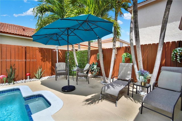view of pool featuring a fenced in pool, a fenced backyard, and a patio