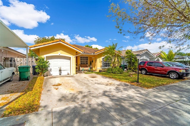 view of front of property with a garage, a tile roof, driveway, and stucco siding