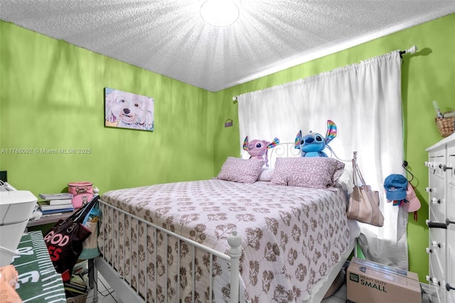 bedroom featuring a textured ceiling