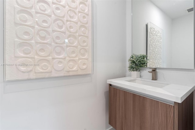 bathroom with vanity and visible vents
