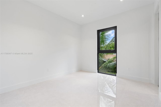 spare room featuring recessed lighting, baseboards, and light carpet