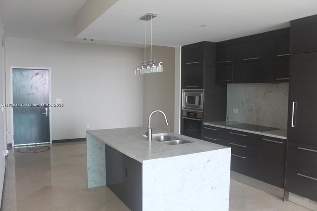900 Biscayne Blvd Unit 3803, Miami, FL 33132 - kitchen featuring an island with sink, stainless steel appliances, dark cabinets, a sink, and modern cabinets