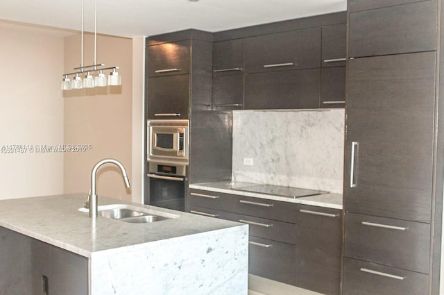 900 Biscayne Blvd Unit 3803, Miami, FL 33132 - kitchen with tasteful backsplash, modern cabinets, stainless steel appliances, and a sink