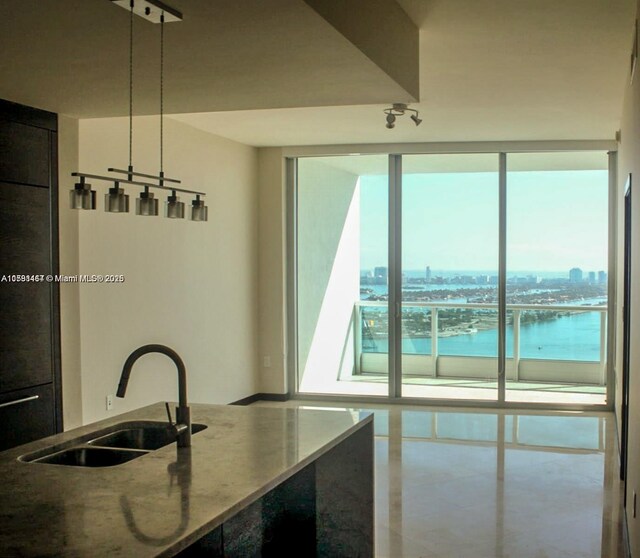 900 Biscayne Blvd Unit 3803, Miami, FL 33132 - kitchen featuring a sink, a water view, and stone counters