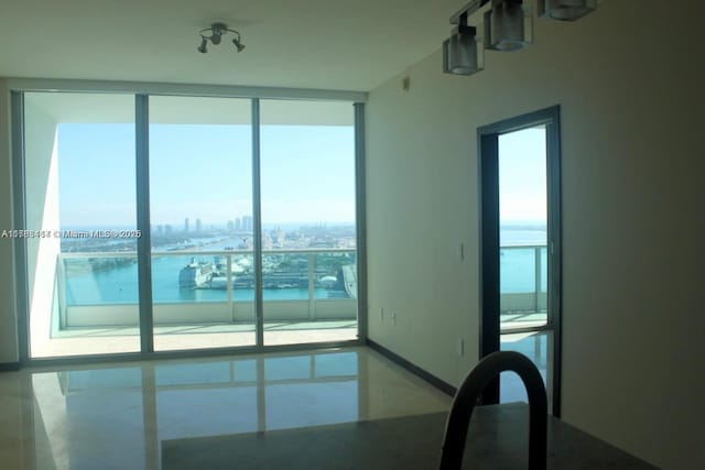 900 Biscayne Blvd Unit 3803, Miami, FL 33132 - empty room with a view of city, a water view, and floor to ceiling windows