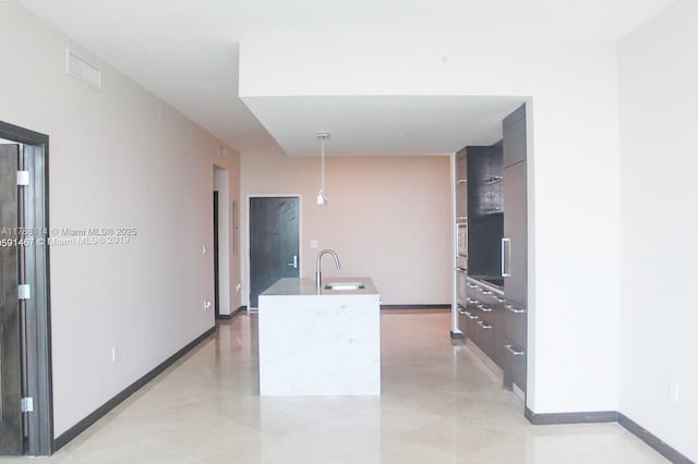 900 Biscayne Blvd Unit 3803, Miami, FL 33132 - kitchen with a sink, a center island with sink, visible vents, modern cabinets, and decorative light fixtures