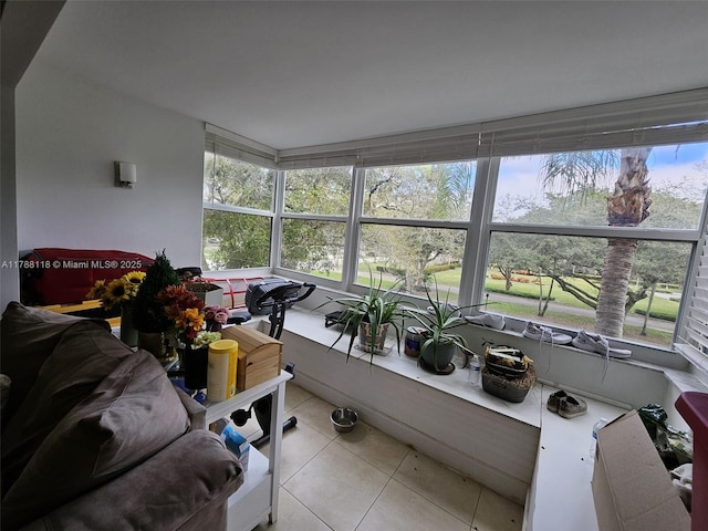 sunroom featuring plenty of natural light and tile patterned flooring