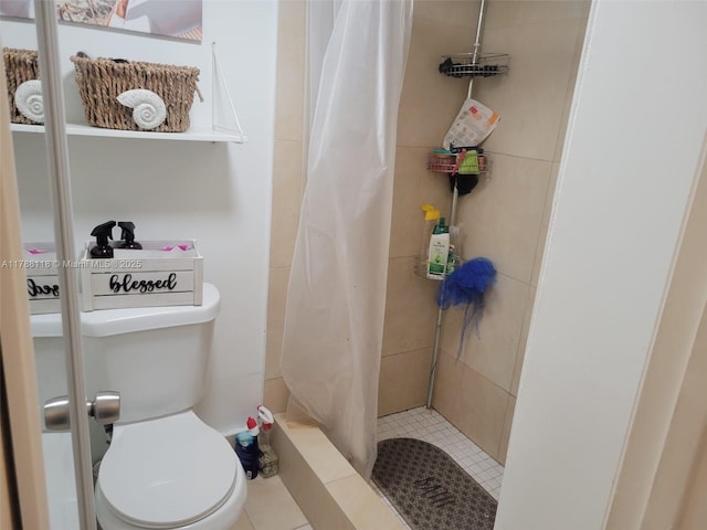 bathroom with toilet and a stall shower