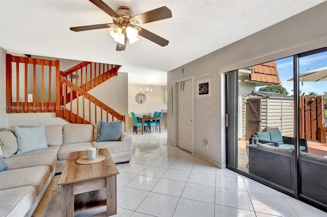 11914 SW 12th Ct, Davie, FL 33325 - living area with stairway, a chandelier, ceiling fan, light tile patterned flooring, and a textured ceiling