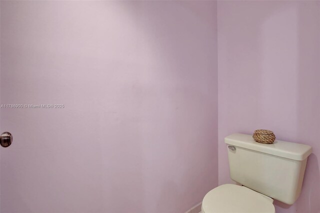 11914 SW 12th Ct, Davie, FL 33325 - bathroom featuring toilet and baseboards