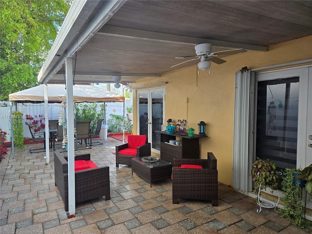 13061 SW 56th Ter, Miami, FL 33183 - view of patio featuring outdoor lounge area, ceiling fan, french doors, and fence