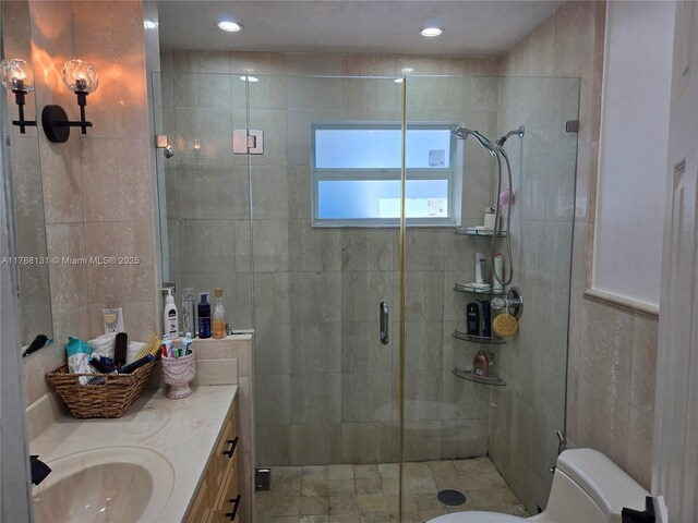 13061 SW 56th Ter, Miami, FL 33183 - bathroom featuring recessed lighting, tile walls, toilet, vanity, and a stall shower